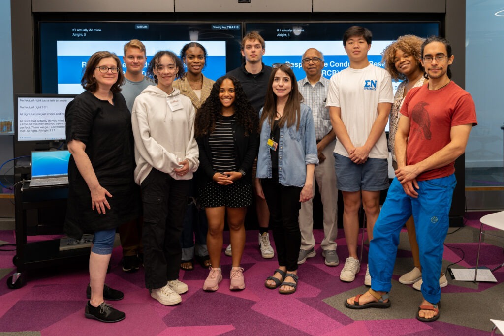 A group of people pose for a photo.