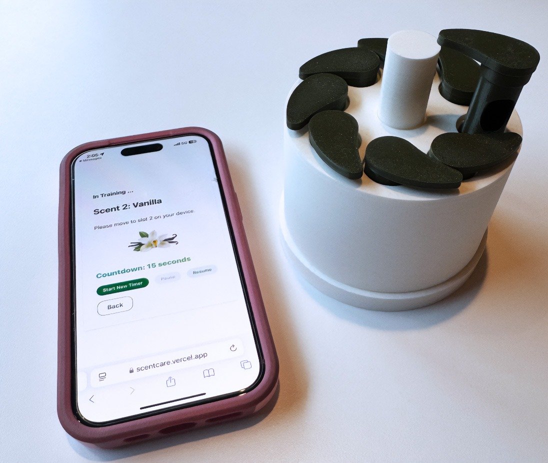 ScentCare systems has a cylinder case containing scented inhaler cartridges, and a companion smartphone app that guides users through smell testing and retraining exercises