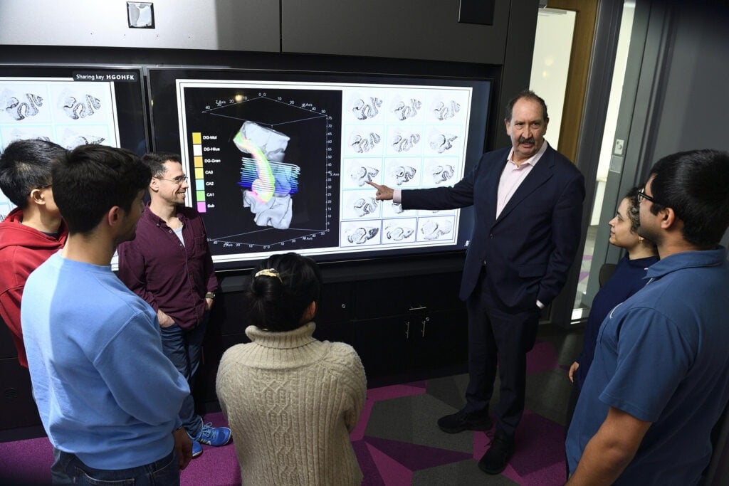 Michael Miller, center, and researchers in the Department of Biomedical Engineering